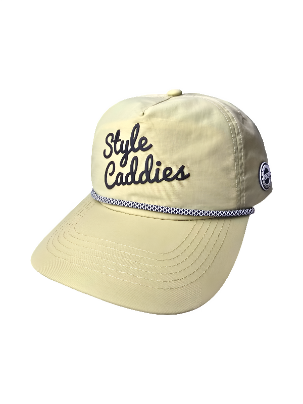 Tan nylon golf hat with black style caddies signature and rope