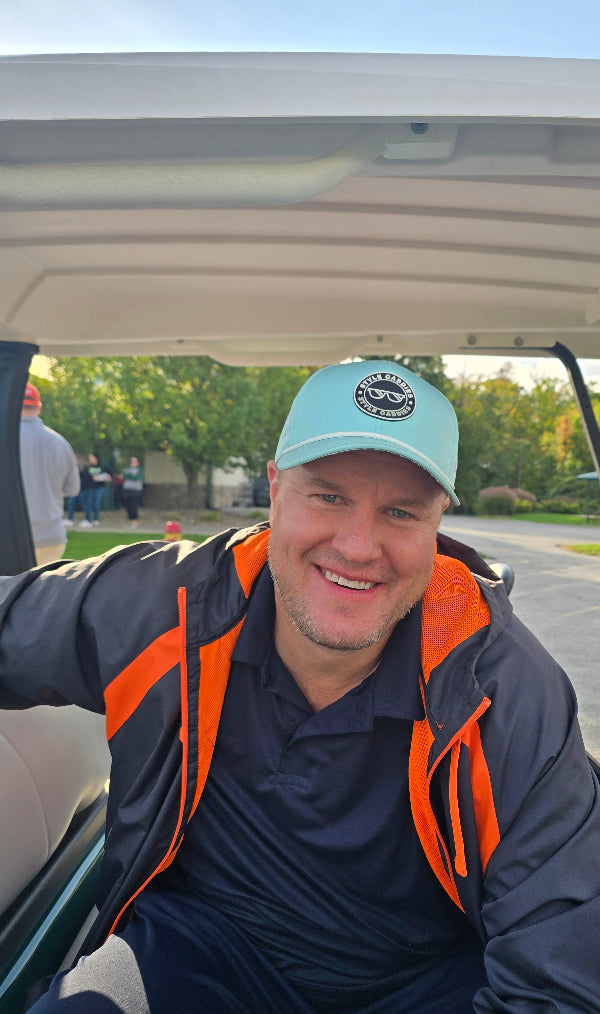 performance hat with blue and cement and rope with logo