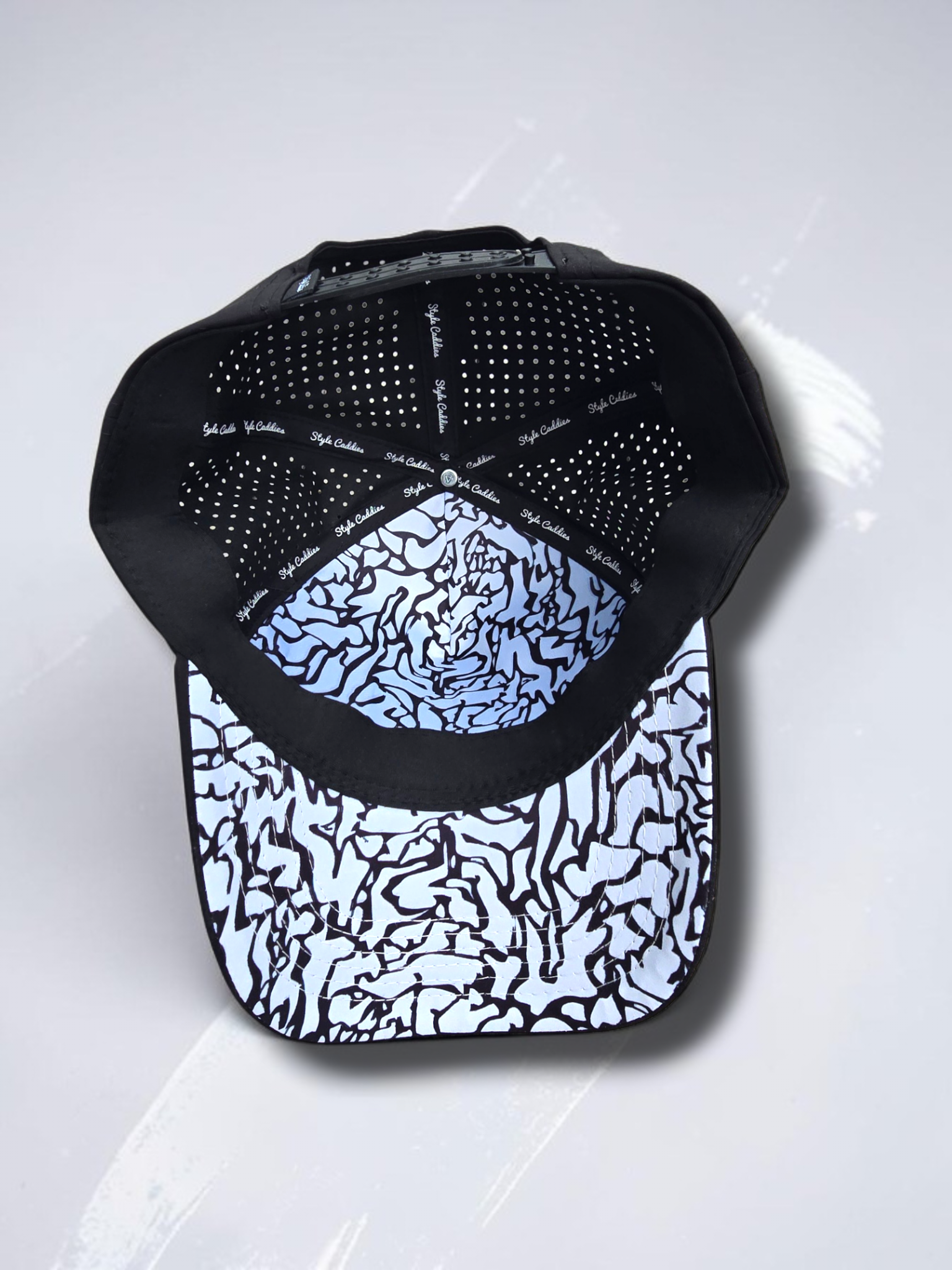 Black Style Caddies hat side profile on a white background