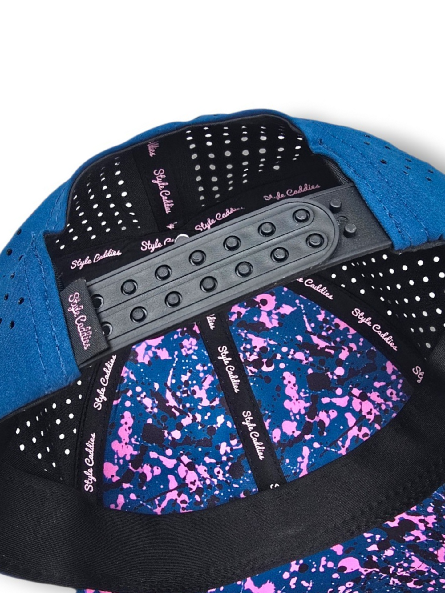 Navy Style Caddies hat side profile close-up showing the perforated panel and circular logo patch