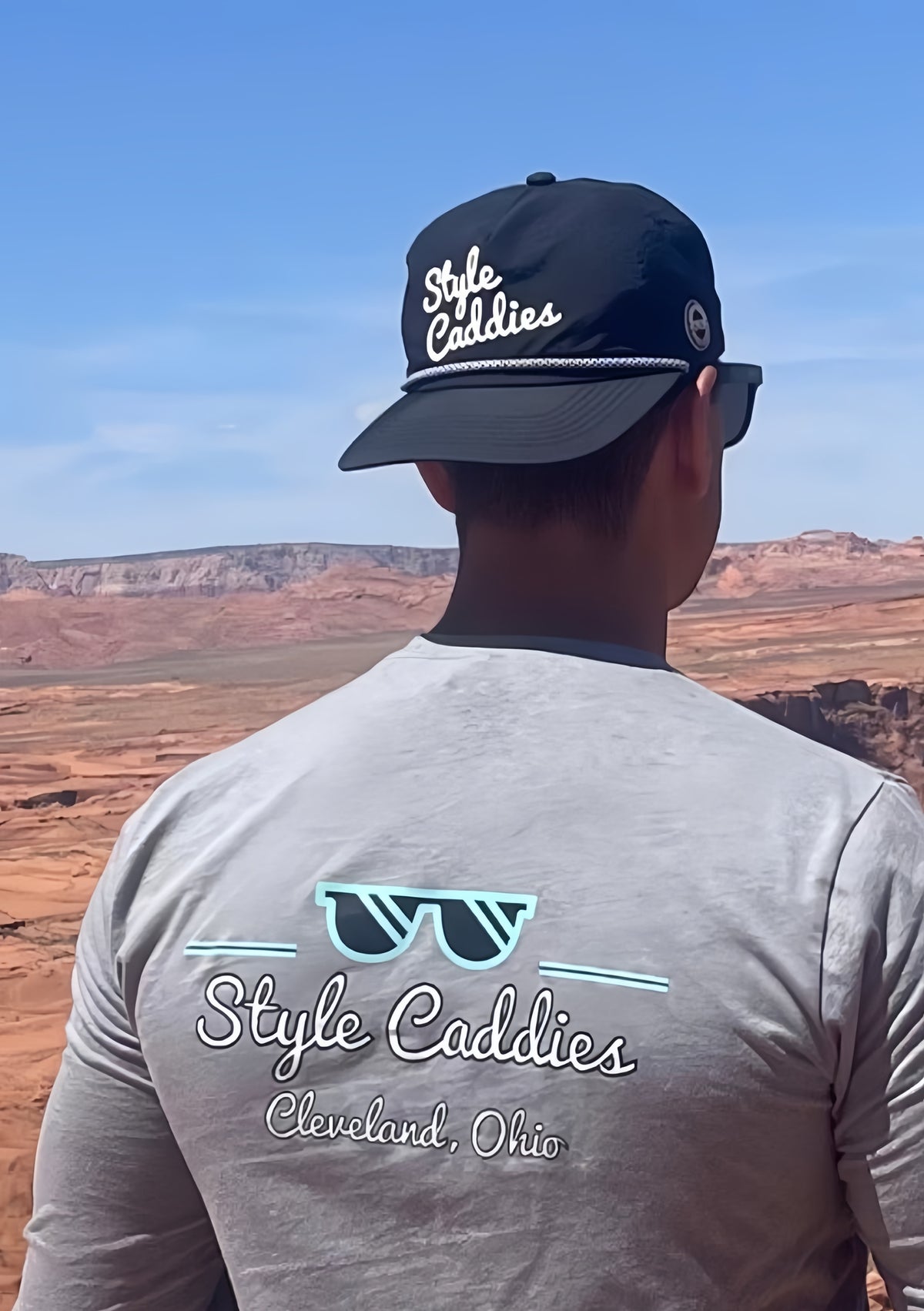 Black nylon golf hat lifestyle shot on course