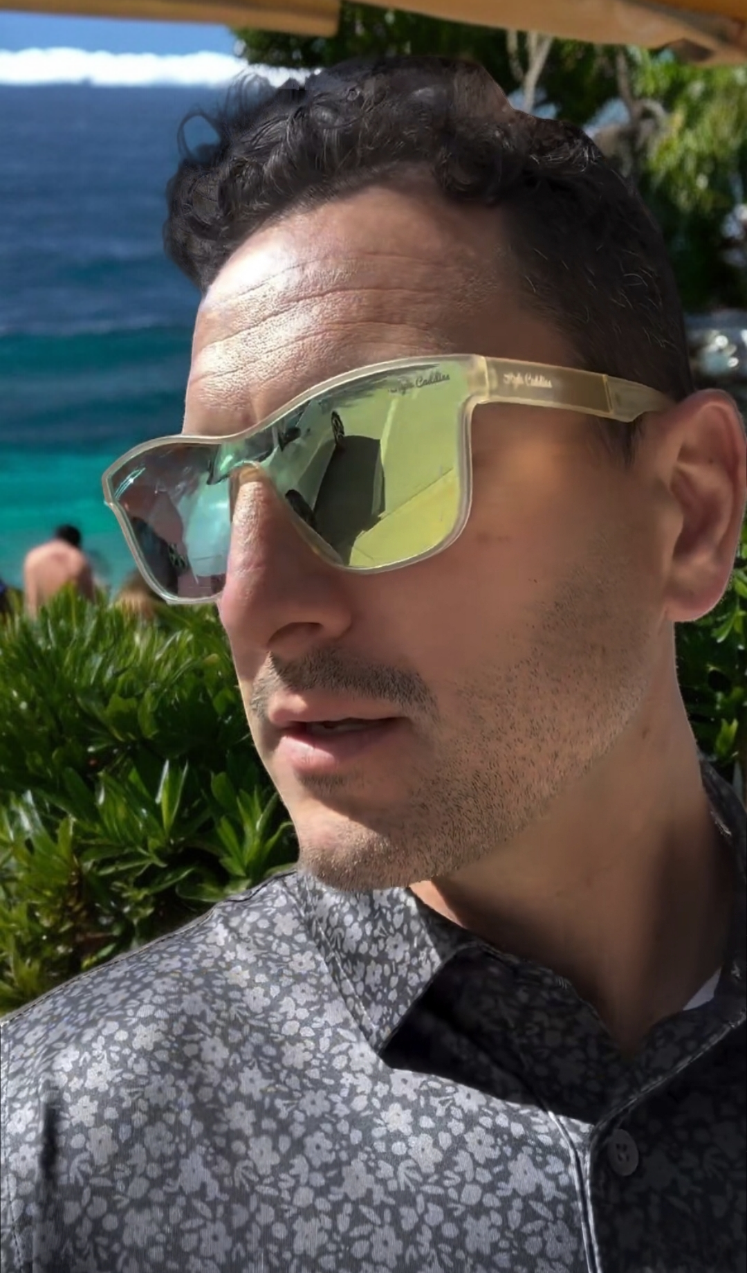 Gold golf sunglasses UV protection on white background