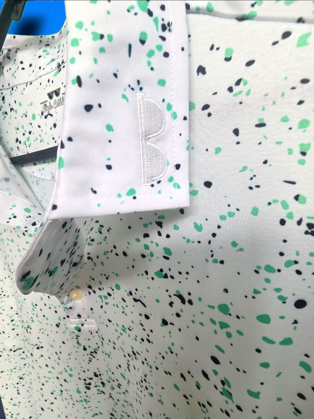 Hint of mint golf polo close up speckle pattern detail