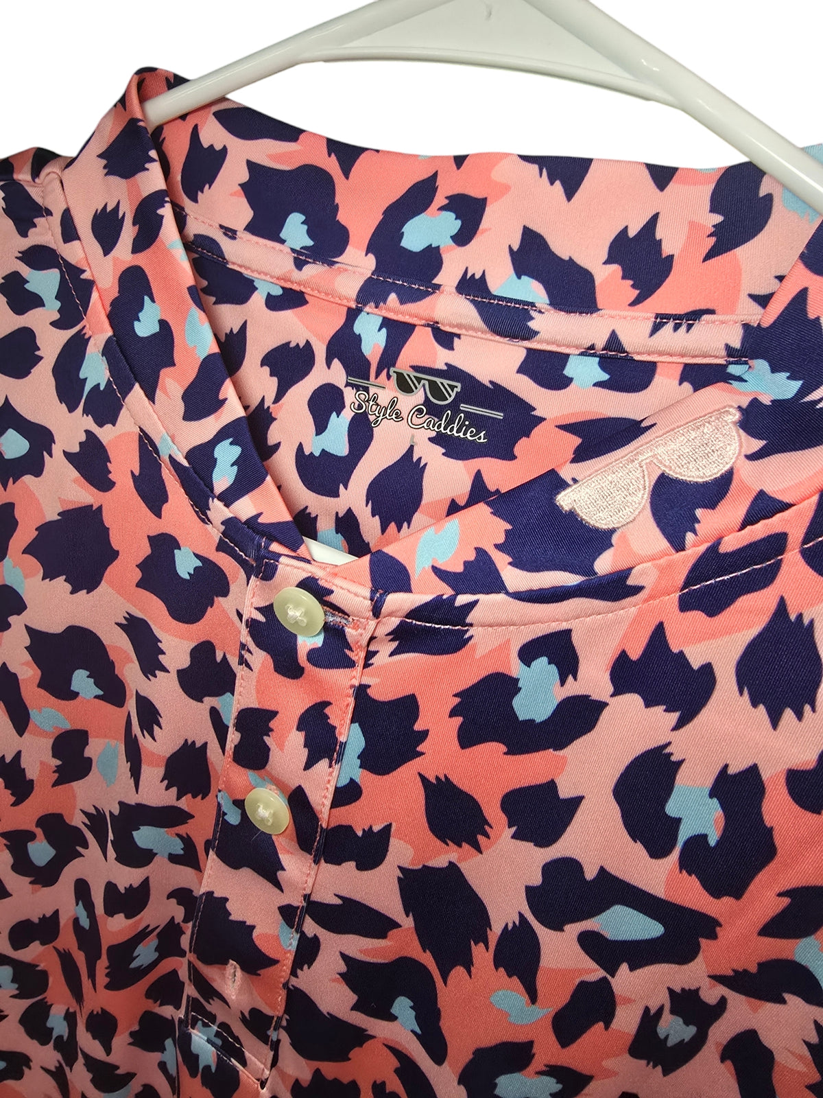 Pink leopard blade polo shirt worn on course